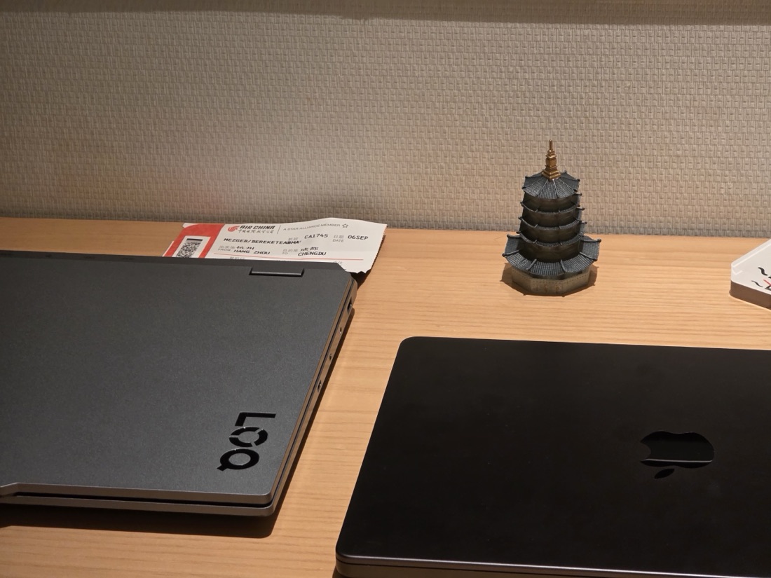 Flight ticket from Hangzhou to Chengdu and a souvenir pagoda